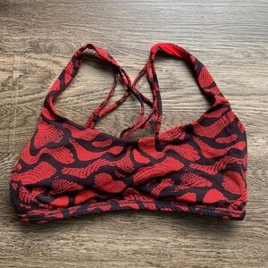 Lululemon red sports bra size 8 medium light support animal print athletic EUC
